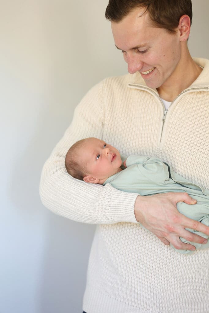 Richmond newborn photographer session featuring baby Cooper and his family in their sunlit Rockville home with their dog Riley