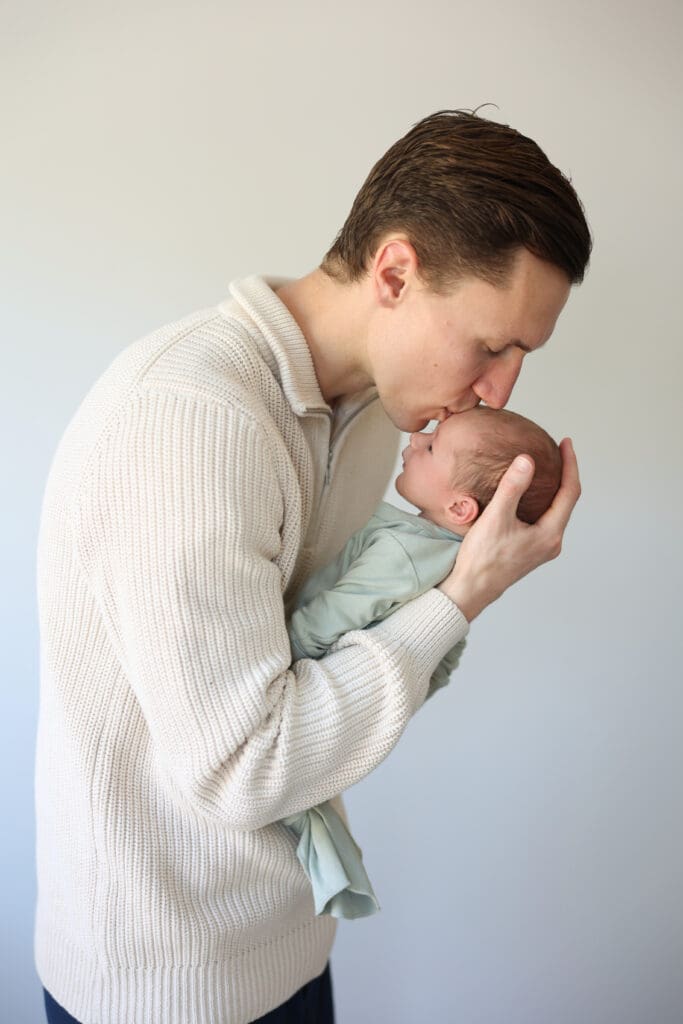 Richmond newborn photographer session featuring baby Cooper and his family in their sunlit Rockville home with their dog Riley